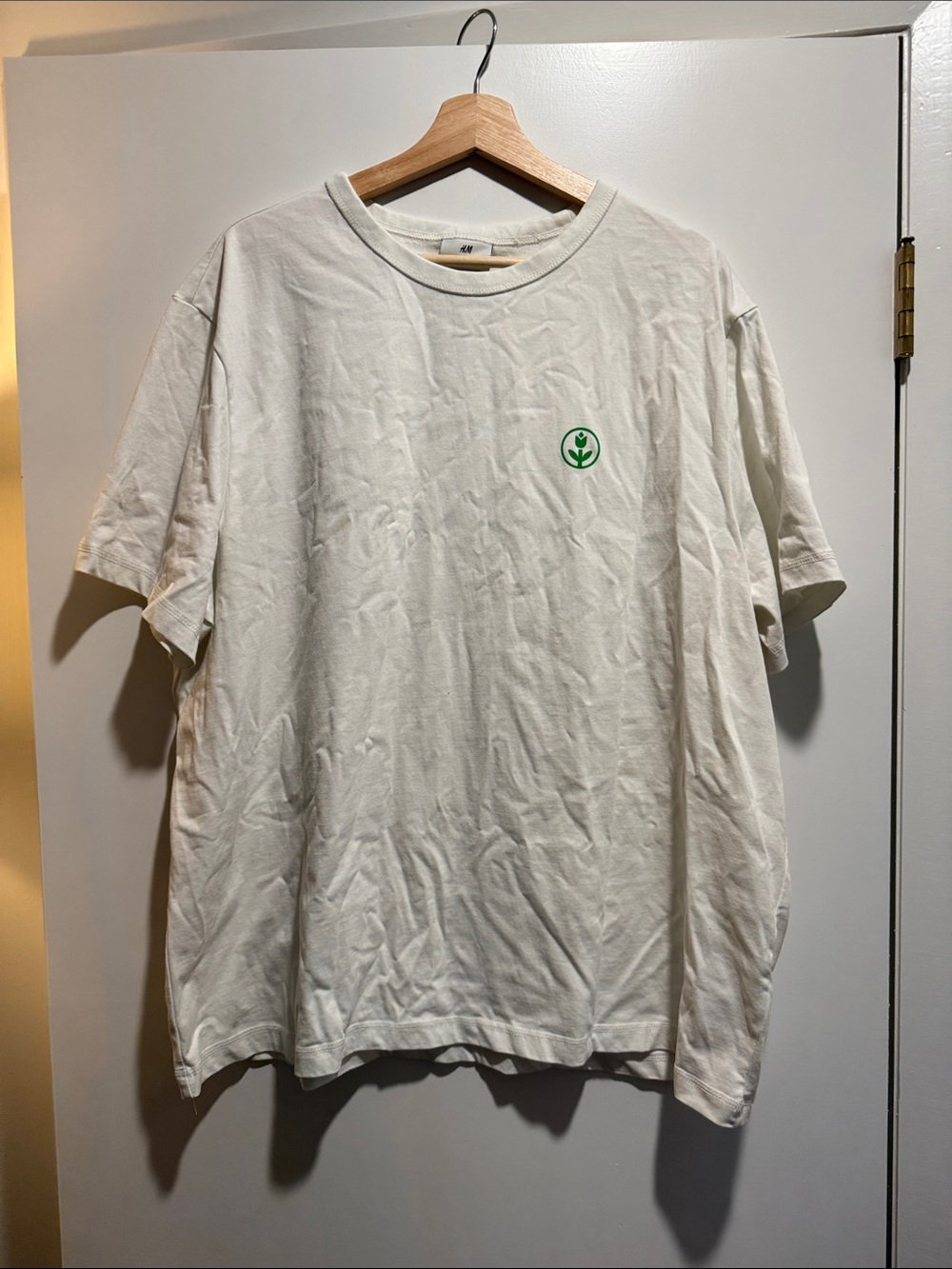 H&M Cream Short Sleeve Tee with Green Chest Emblem
